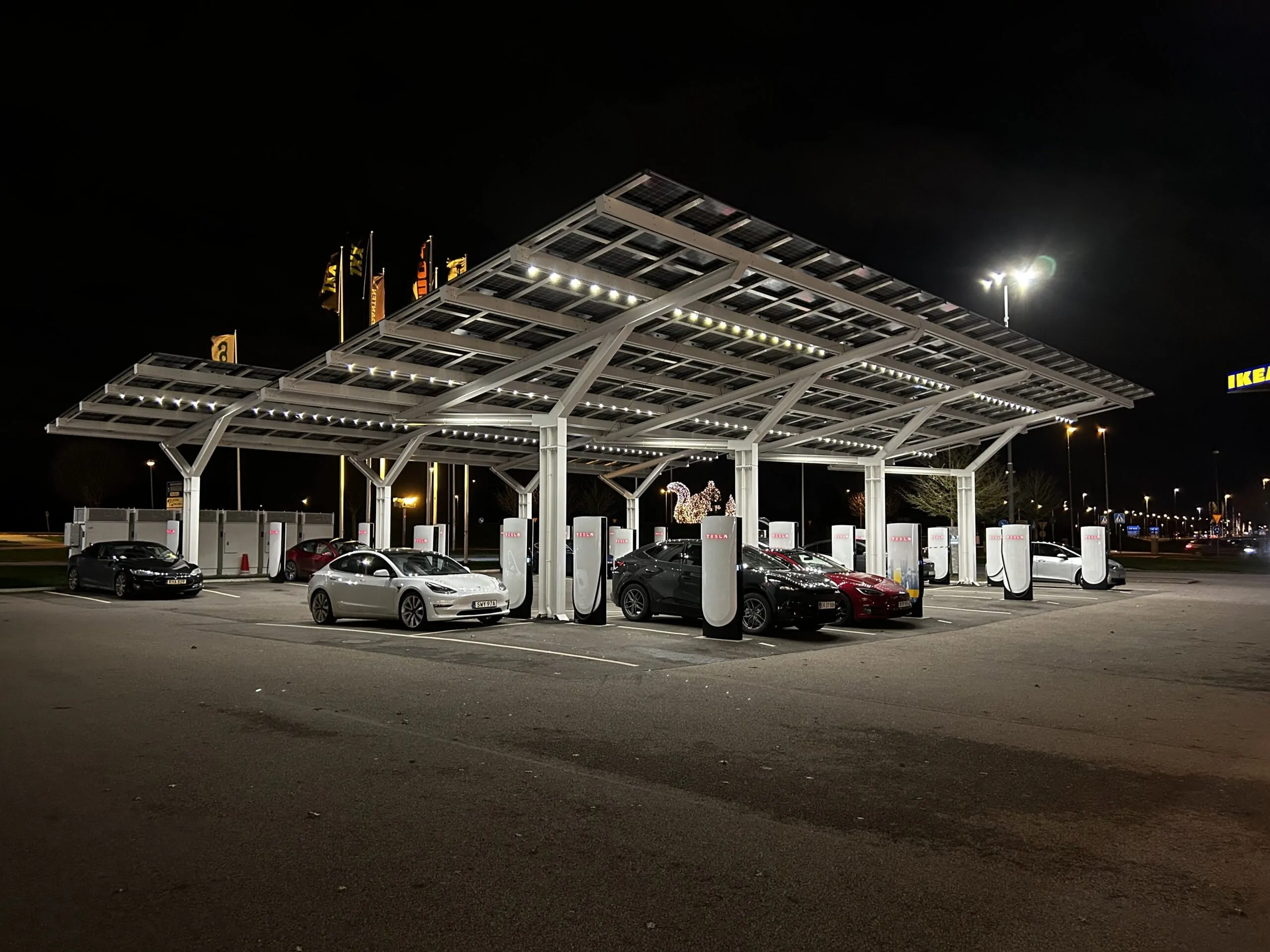 Tesla-Helsingborg-1 Solar parking canopies at a Tesla charging station in Helsingborg, Sweden